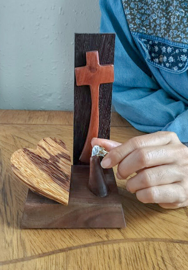 Luxury wooden wedding ring holder with cross and heart design, handmade by artisan KS Marsau at Luxe Ring Haven. Makes a unique Gift for Bride from Groom.