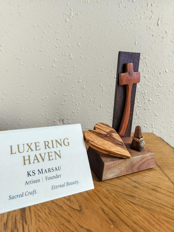 Luxury wooden wedding ring holder with cross and heart design, handmade by artisan KS Marsau at Luxe Ring Haven. Makes a unique Gift for Bride from Groom.