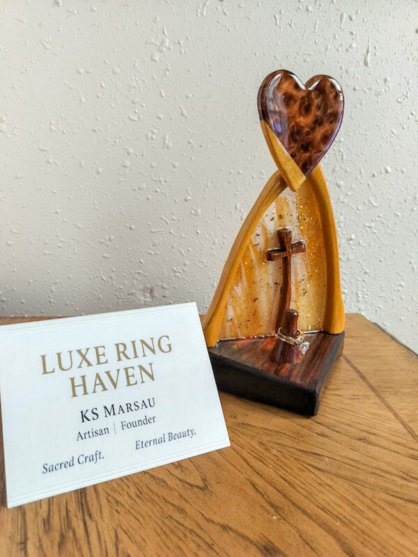 Luxury wooden wedding ring holder with cross and heart design, handmade by artisan KS Marsau at Luxe Ring Haven. Makes a unique Gift for Bride from Groom.