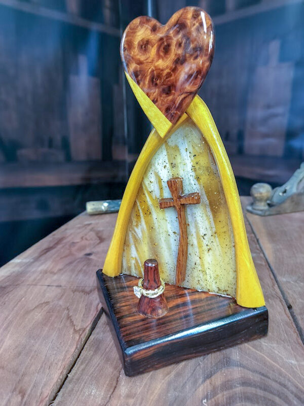 Luxury wooden wedding ring holder with cross and heart design, handmade by artisan KS Marsau at Luxe Ring Haven. Makes a unique Gift for Bride from Groom.
