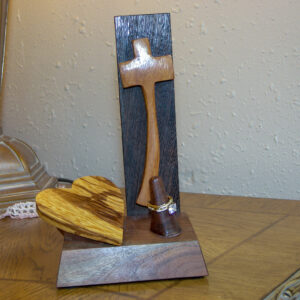 Luxury wooden wedding ring holder with cross and heart design, handmade by artisan KS Marsau at Luxe Ring Haven. Makes a unique Gift for Bride from Groom.