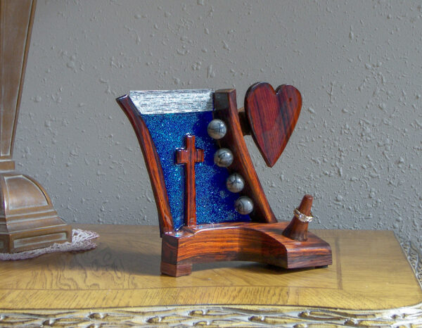 "Heaven's Radiance – Sapphire Light Ring Holder with Cross and Heart"
