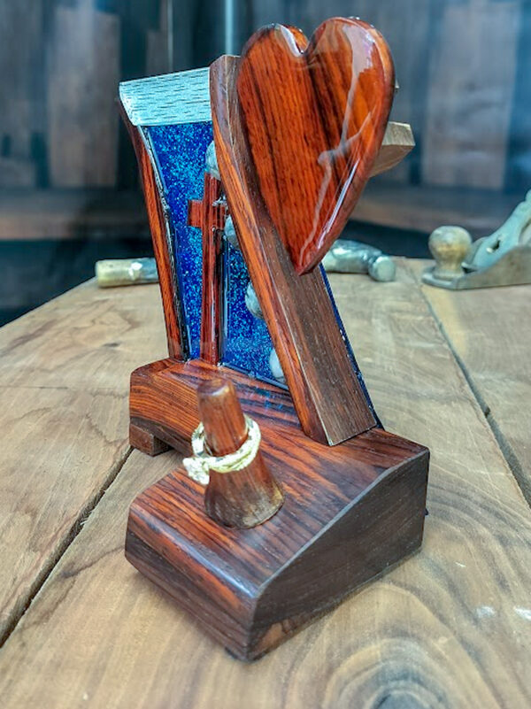 Luxury wooden wedding ring holder with cross and heart design, handmade by artisan KS Marsau at Luxe Ring Haven. Makes a unique Gift for Bride from Groom.