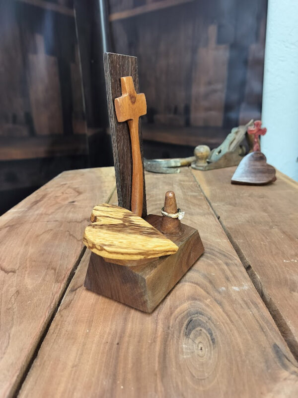 Luxury wooden wedding ring holder with cross and heart design, handmade by artisan KS Marsau at Luxe Ring Haven. Makes a unique Gift for Bride from Groom.