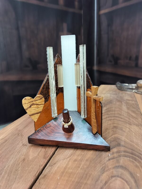 Luxury wooden wedding ring holder with cross and heart design, handmade by artisan KS Marsau at Luxe Ring Haven. Makes a unique Gift for Bride from Groom.