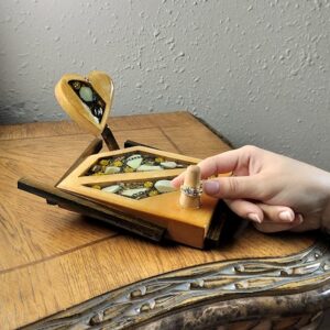 Luxury wooden wedding ring holder with cross and heart design, handmade by artisan KS Marsau at Luxe Ring Haven. Makes a unique Gift for Bride from Groom.