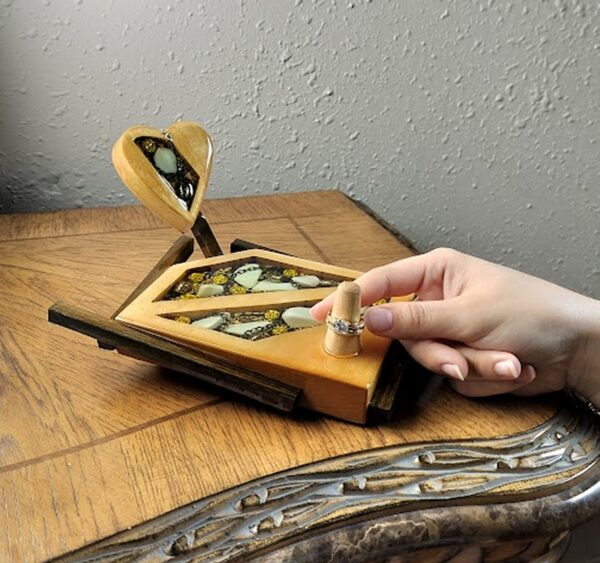 Luxury wooden wedding ring holder with cross and heart design, handmade by artisan KS Marsau at Luxe Ring Haven. Makes a unique Gift for Bride from Groom.