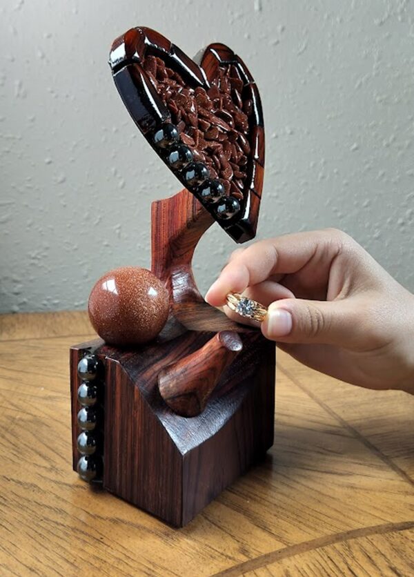 Luxury wooden wedding ring holder with cross and heart design, handmade by artisan KS Marsau at Luxe Ring Haven. Makes a unique Gift for Bride from Groom.